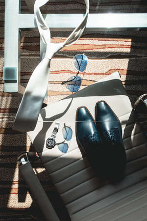 Wedding details. Classic groom accessories on a glass tableの写真素材