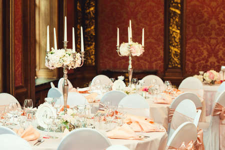 Simple and elegant wedding or festive table setting. beige and peach colorsの写真素材