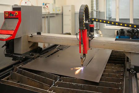 Industrial laser or plasma cutting processing manufacture technology of flat metal sheet. unit in actionの写真素材