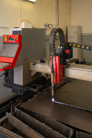 Industrial laser or plasma cutting processing manufacture technology of flat metal sheet. unit in actionの写真素材
