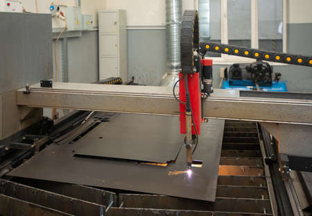 Industrial laser or plasma cutting processing manufacture technology of flat metal sheet. unit in actionの写真素材