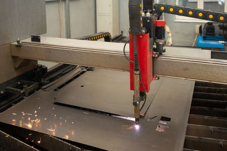Industrial laser or plasma cutting processing manufacture technology of flat metal sheet. unit in actionの写真素材