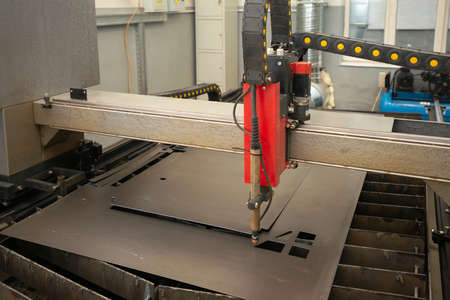 Industrial laser or plasma cutting processing manufacture technology of flat metal sheet. unit in actionの写真素材