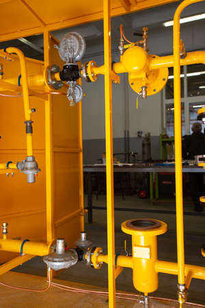 gas equipment. Yellow pipes. gas switching cabinetの写真素材