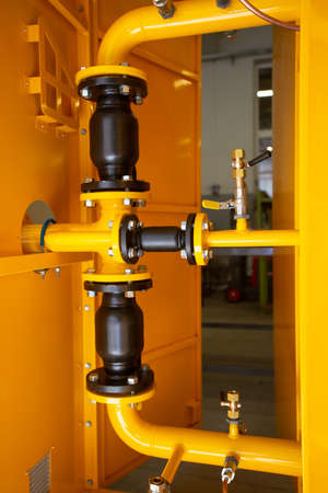 gas equipment. Yellow pipes. gas switching cabinetの写真素材