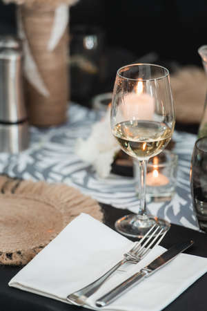 Glass of cold dry white wine served indoor in cafe.の写真素材