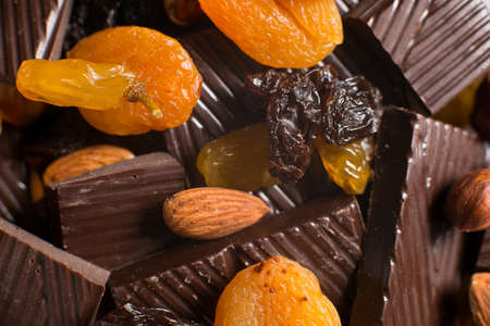Homemade chocolate bar with almond on craft paper background. Concept of healthy homemade sweetsの写真素材
