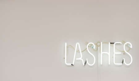 Shining Lashes white Neon Label. advertising for a beauty salonの写真素材