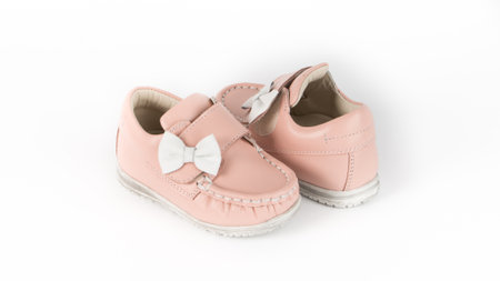 childrens beige orthopedic moccasins on a white backgroundの写真素材