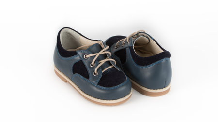 childrens blue orthopedic shoes on a white backgroundの写真素材