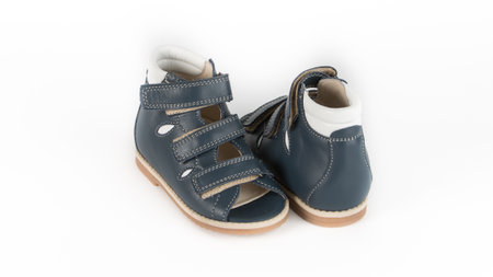 childrens blue orthopedic sandals on a white backgroundの写真素材