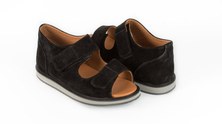 childrens black orthopedic sandals on a white backgroundの写真素材