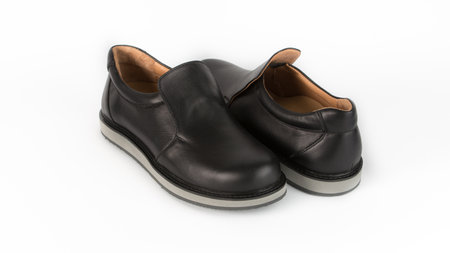 childrens black orthopedic shoes on a white backgroundの写真素材