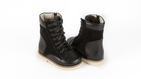 childrens black orthopedic shoes on a white backgroundの写真素材