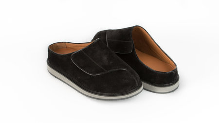 childrens black orthopedic slippers on a white backgroundの写真素材