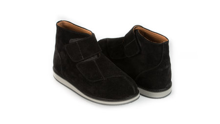 childrens black orthopedic shoes on a white backgroundの写真素材