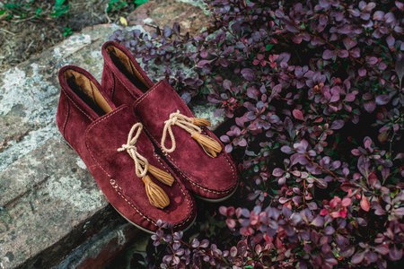 mens shoes moccasins cherry color. photo on the streetの写真素材
