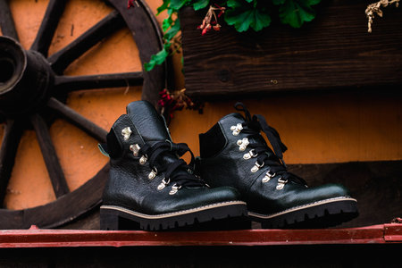 High womens or unisex shoes. Pair of boots with shoe laces. Modern youth fashion of womens casual...
