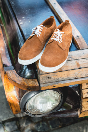 yellow suede shoes with white soles. Street photoの写真素材