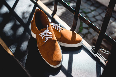 yellow suede shoes with white soles. Street photoの写真素材
