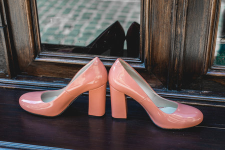 Pair of Womans beige lacquered shoes. Natural lightの写真素材