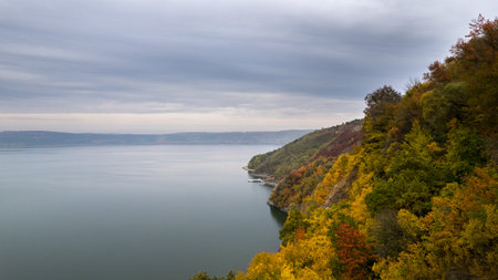 Autumn view on panorama of the Dniester River. landscape with canyon, forest and a river in front....
