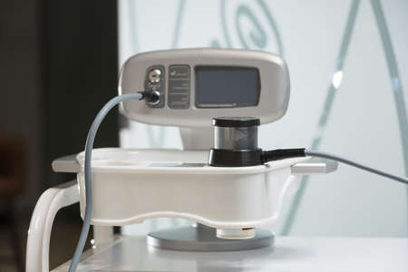 Woman cosmetology procedure device. Machine for light face treatment. Medical skin repair. Anti wrinkle.の写真素材