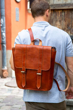 Brown leather backpack isolated on whiteの写真素材