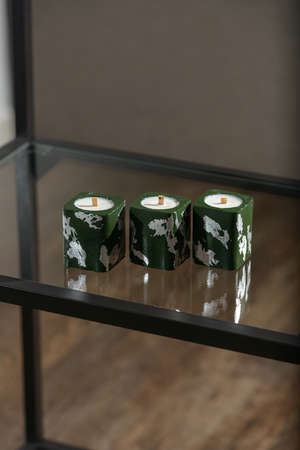 Set of stone Candle Holder with abstract smudges, green concrete with silver flame. selective soft focusの写真素材