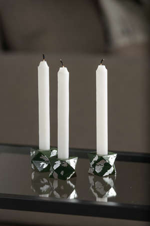 Set of stone Candle Holder with abstract smudges, green concrete with silver flame. selective soft focusの写真素材