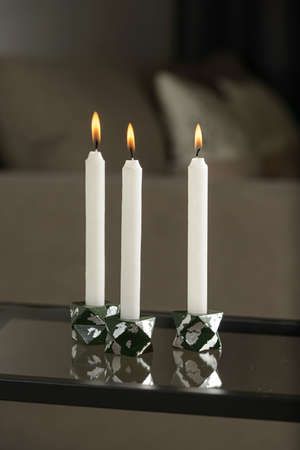 Set of stone Candle Holder with abstract smudges, green concrete with silver flame. selective soft focusの写真素材