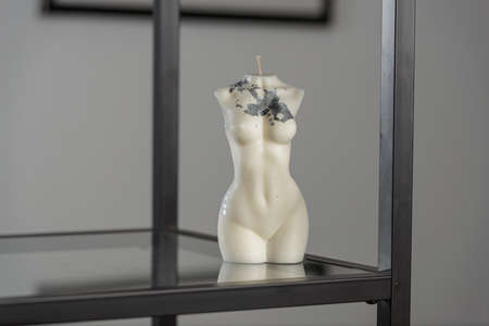 White candle in the shape of a womans bodyの写真素材
