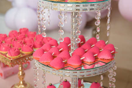 Dessert table for a party. cupcakes, sweetness and fruitsの写真素材