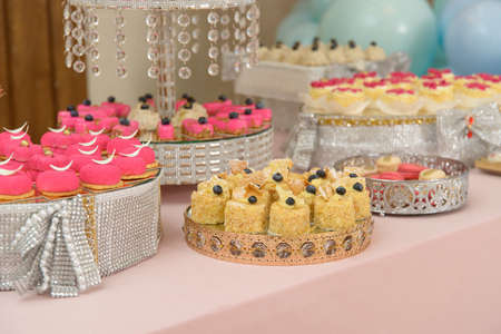 Dessert table for a party. cupcakes, sweetness and fruitsの写真素材