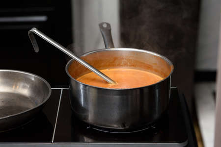 sauce preparation process of Suquet de Peix soup with potatoesの写真素材