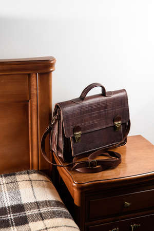 Brown leather briefcase with two locks. hotel room photoの写真素材