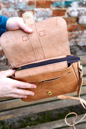 close-up photo of yellow leather handbagの写真素材