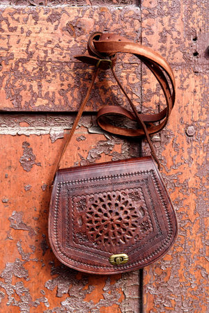 small brown womens leather bag with a carved pattern. selective focusの写真素材