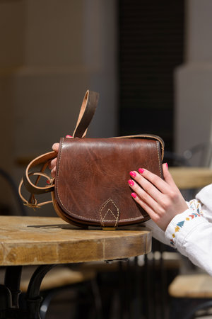 small yellow womens leather bag with rivets. selective focusの写真素材