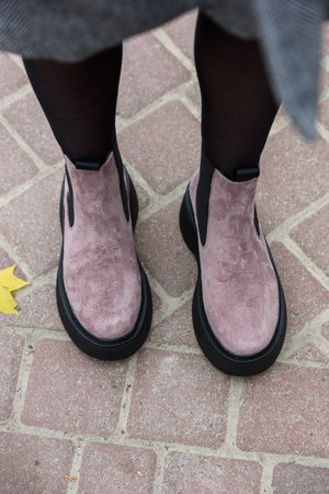 Womens autumn pink suede ankle boots. Fashion shoes. Outdoorsの写真素材