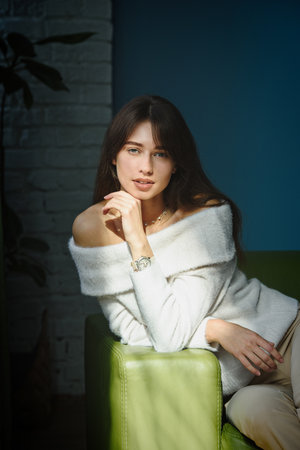 Beautiful young brunette woman portrait. indoor shotの写真素材