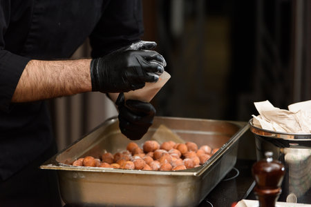 Beautiful breakfast. Croatian donuts with potatoes and raisinsの写真素材