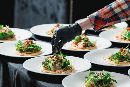 The chef at the restaurant making Spicy Shrimp Tacos with Coleslaw and Salsaの写真素材