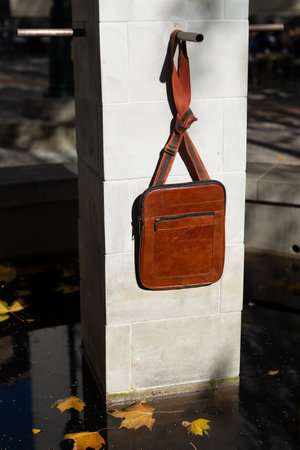 close-up photo of light brown messanger leather bagの写真素材