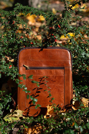 close-up photo of light brown messanger leather bagの写真素材