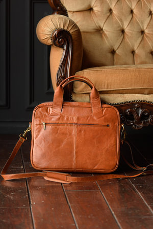 close-up photo of orange leather bag corporate.の写真素材