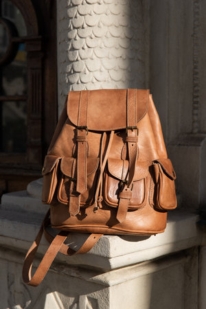 photo of a light brown, retro look leather backpackの写真素材