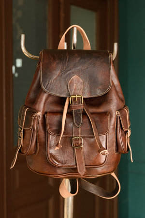 brown leather oldfashioned backpack. indoors photoの写真素材