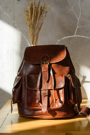 brown leather oldfashioned backpack. indoors photoの写真素材