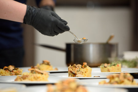preparation of paella with chicken and musselsの写真素材